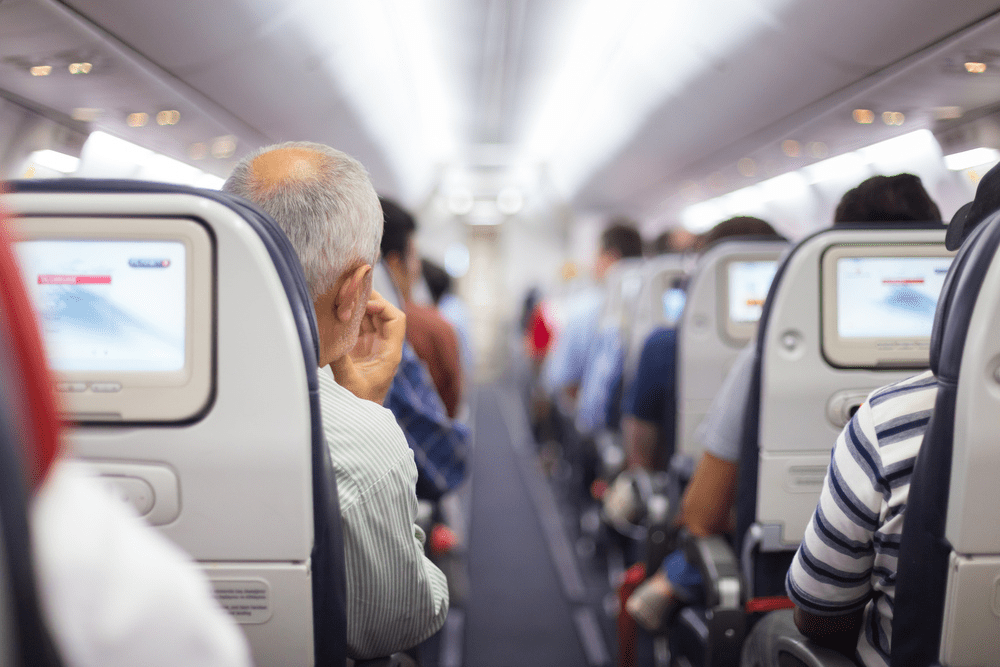 Passengers seated in plane