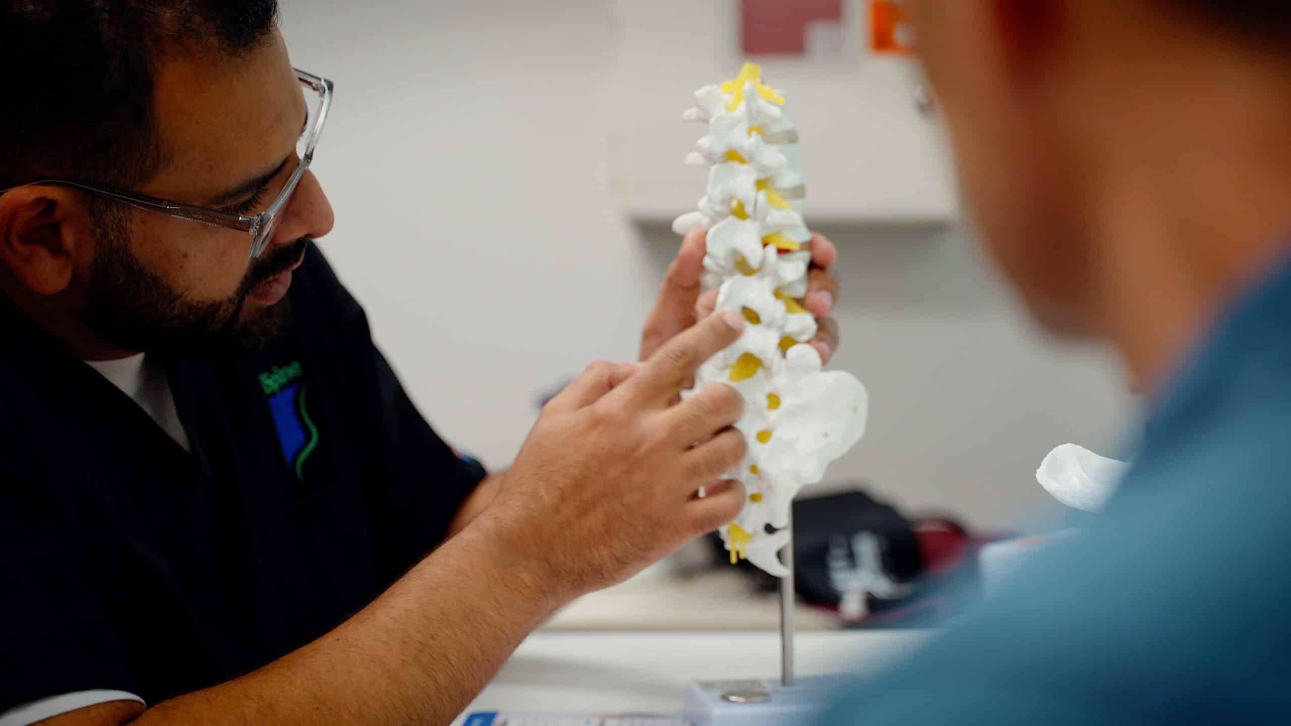 Dr Faltas iSpine Clinics explaining spine pain to patient