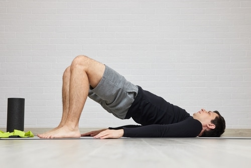 man doing glute bridge stretch